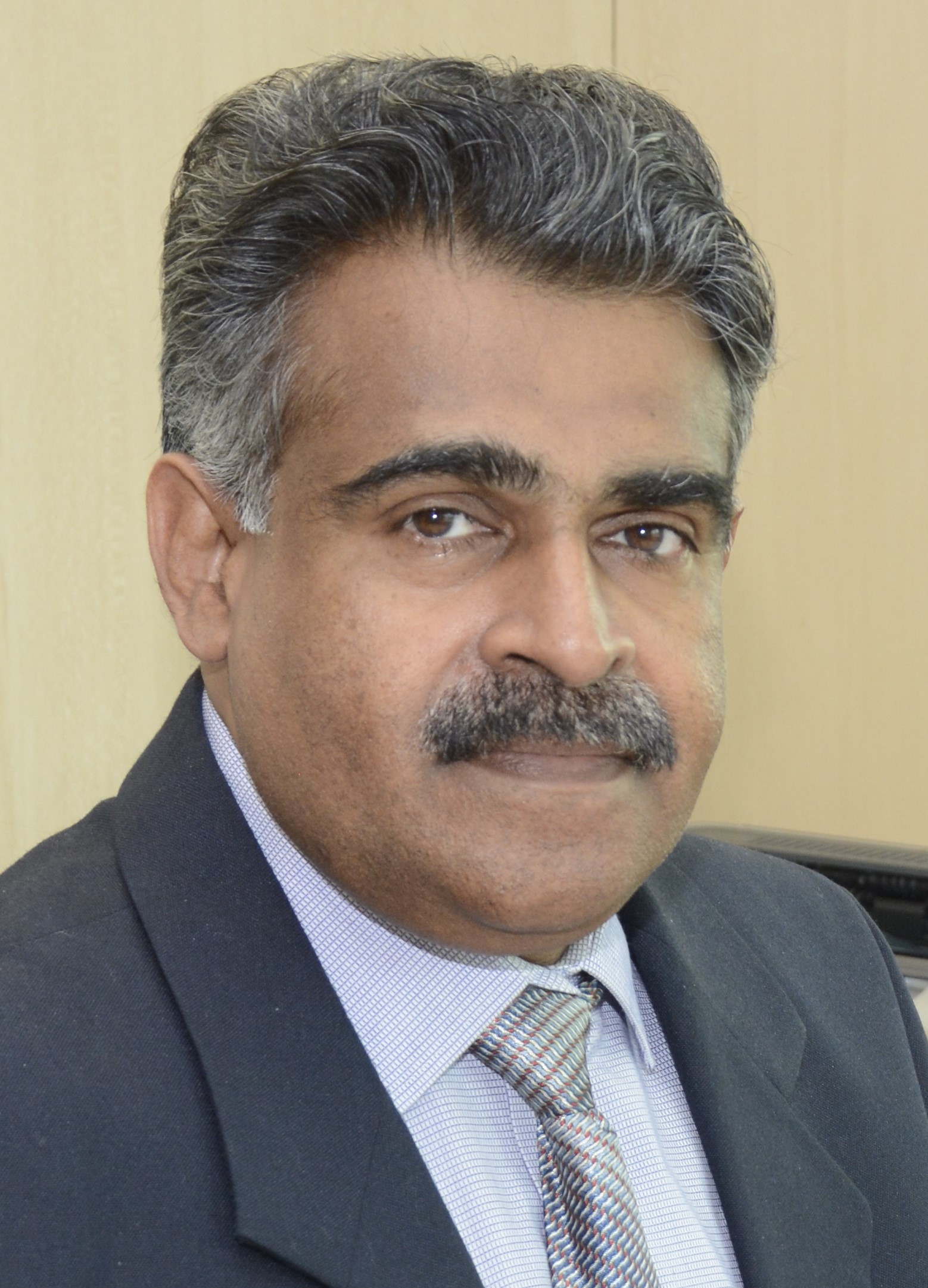 Dr. George E. Thomas, Insurance Research Expert